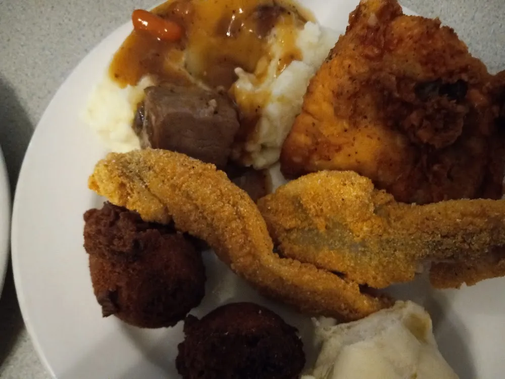 Fish Hush Puppies Mashed Potatoes and Gravy with Roast Beef and Fried Chicken